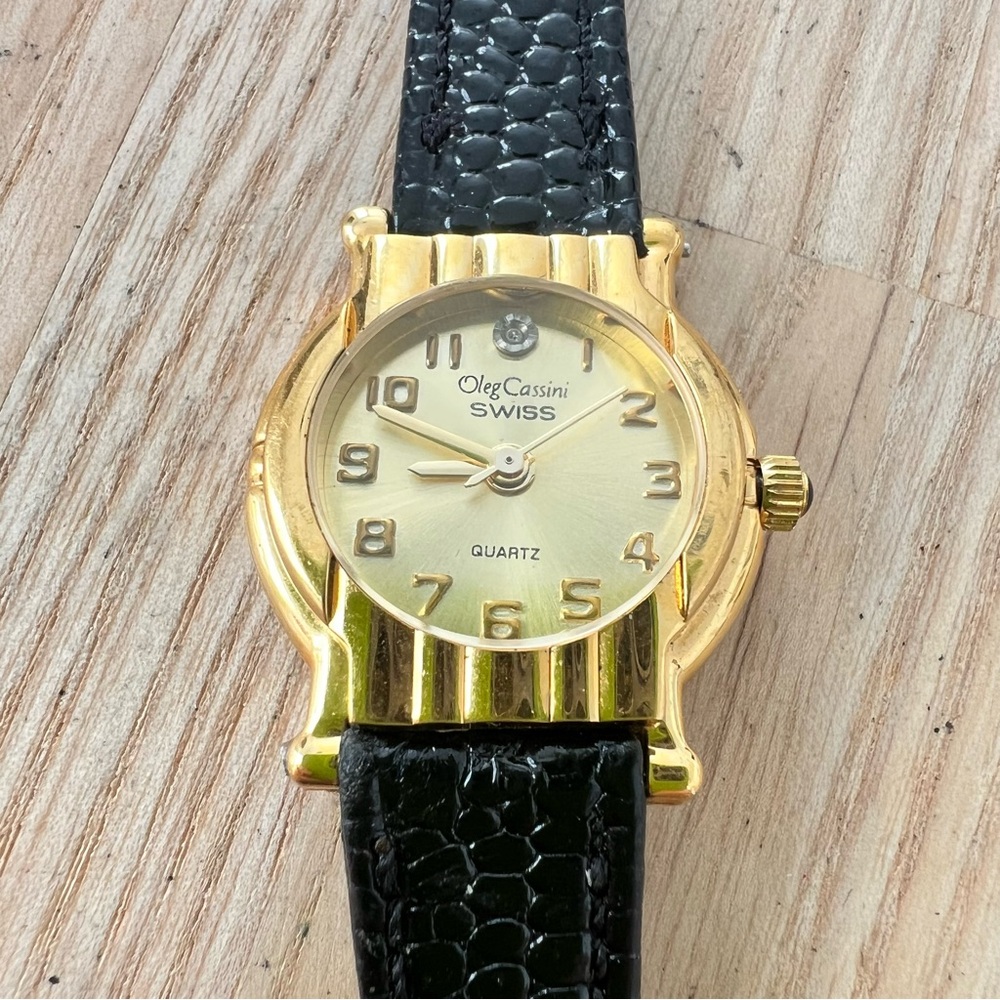 Vintage Oleg Cassini ladies gold tone black leather watch NEW BATTERY